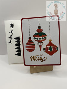 Christmas Baubles Card - Red version: ink blended Christmas ornaments with foil accents in gold. External sentiment reads: "Oh so Merry" and the internal sentiment reads "The most heartfelt of Christmas wishes to you and your family." A2 size card: 4.25 x 5.5”. Coordinating envelope (shown) included. 