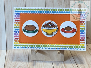 Mini slimline birthday cards for kids.  White card base, scalloped panel of rainbow coloured patterned paper and an orange rectangular panel of coloured cardstock with faux stitching. Hand coloured images of sweets are popped up on three mini circular panels. Internal sentiment reads "happy birthday". Card size is 3.5 x 6" (mini slim) with a coordinating white envelope included.