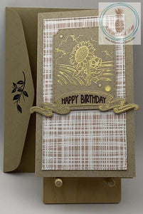 A happy birthday card with a sunflower scene embossed in gold. Two versions: linen pattern background. shown. Slimline card: 3.5 x 6.5". Coordinating envelope (shown) included.