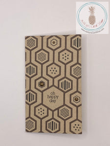 Masculine birthday card with a hexagon pattern stamped on the front card panel in Brown/Black combinations Sentiment adds some humour to the occasion: oh happy day (external) and happy anniversary of your terrestrial debut (internal). Mini slim size card: 3.5" x 6". Comes with coordinating envelope.