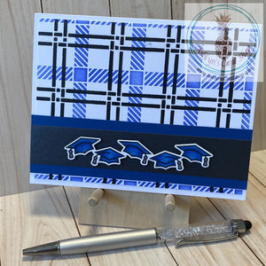 Hand coloured graduation caps popped up on a black shimmer strip of paper and again on blue cardstock. The strip was attached to a blended plaid background of blue and black. Inside sentiment reads "the tassel was worth the hassle". A2 card size: 4.25 x 5.5".  Coordinating envelope included.
