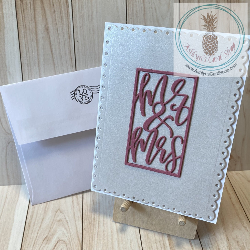 Shimmery wedding card shown with coordinating envelope.