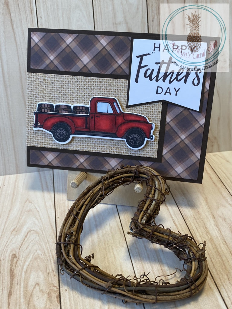 Hand coloured vintage truck with barrel cargo is popped up on a patterned paper banner with cardstock frame. The card base is also patterned paper on a cardstock frame, mounted on a white card base. The external sentiment reads "Happy Father's Day"; internal sentiment reads "Your love has helped me become who I am today. (And let's fact it . . . I'm awesome)". Add a little humour to your Dad's day card. A2 card size: 4.25 x 5.5". Coordinating envelope included. Plaid version shown.