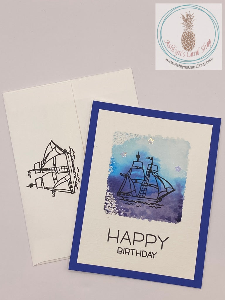 Watercolour wash background stamped with either sunflowers or a ship. The sunflower card reads: happiest of birthdays to you (external) and with age comes wisdom. Happy birthday, genius (internal). A2 size card: 4.25" x 5.5". Comes with coordinating envelope (shown).