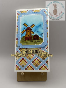 Hand coloured windmill scene on a plaid background. Two sentiment choices: thinking of you/be classy, sassy and a bit smart assy!  And, hello friend (shown)/dip in in chocolate. It'll be fine. Mini slimline card 3.5 x 6.5". Coordinating envelope included.